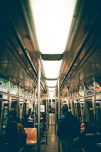 people standing inside of train thumbnail