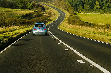 blue car on road during day time thumbnail