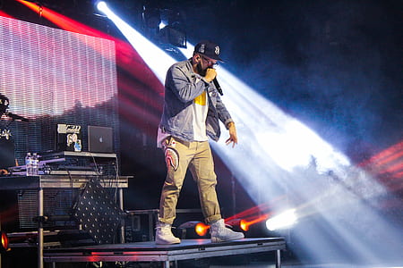 male artist performing on stage thumbnail