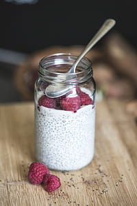 red fruits inside clear glass jar thumbnail