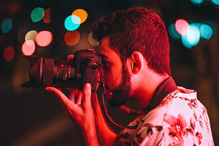 Man Holding Dslr Camera thumbnail