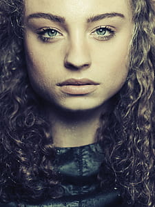 closeup photo of woman wearing black crew-neck top thumbnail