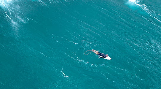 man surfing on sea thumbnail