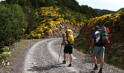 two men walking through rock formations thumbnail