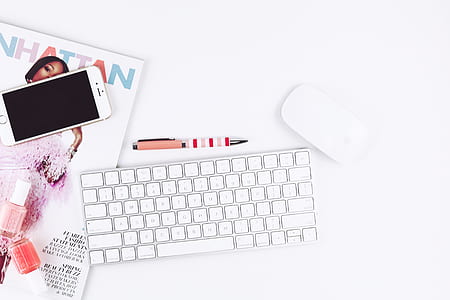 Apple Wireless Keyboard beside Magic Mouse and iPhone 6 thumbnail