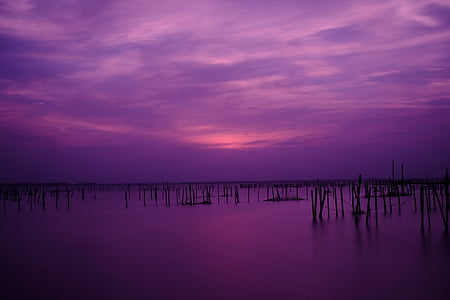 body of water under cloudy sky thumbnail