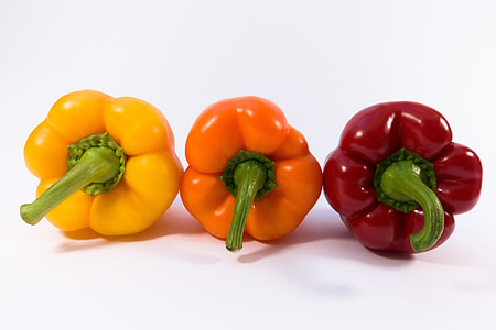 three assorted-color of bell peppers with white background thumbnail