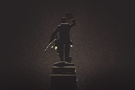statue of a man holding his hat thumbnail