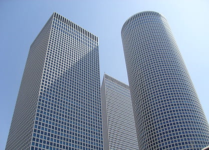 low angle photo of high rise building under blue sky during daytime thumbnail