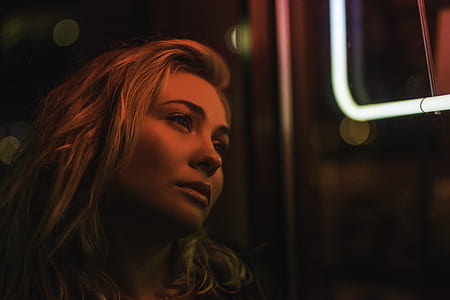 woman looking outside the window thumbnail