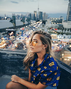 Young Woman On Ferris Wheel Photo thumbnail