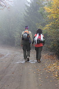 woman holding hands with man on road thumbnail