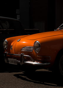 Orange Volkswagen Karmann Ghia Near Building thumbnail