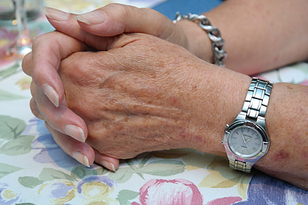 person wearing analog watch and bracelet thumbnail