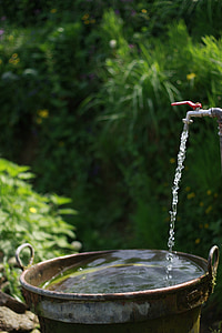 water flowing from faucet into bucket thumbnail