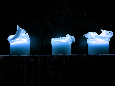 three blue candles on wall thumbnail