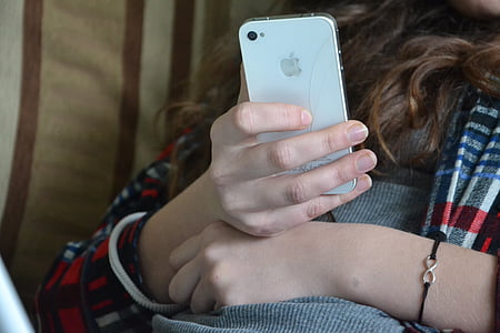 person holding white iPhone 4 thumbnail