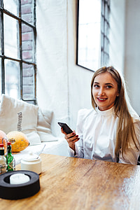 Pretty blonde woman sitting in the cafe thumbnail