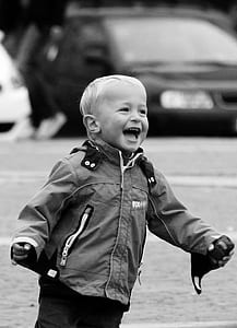 grayscale photo of toddler in jacket thumbnail
