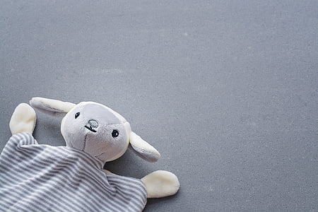 gray and beige animal plush toy on gray surface thumbnail