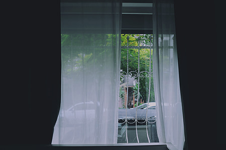 white curtain beside white window grille thumbnail