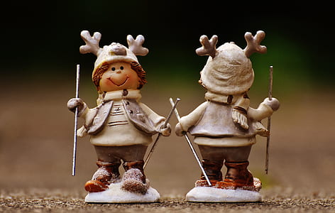 Beige and Brown Boy Skiing Figurine thumbnail