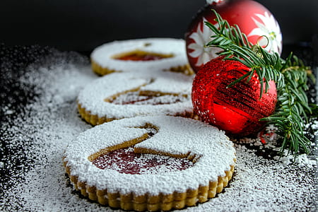 two red baubles beside three cookies thumbnail