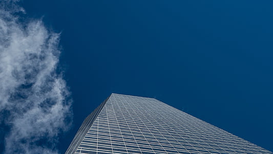 high-rise building under blue clear sky during daytime thumbnail