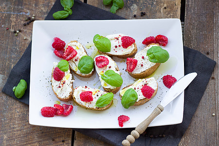 sliced red berries serving on white ceramic plate thumbnail