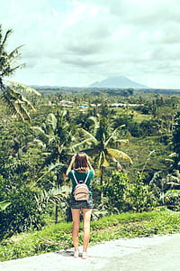 woman taking photo using camera thumbnail