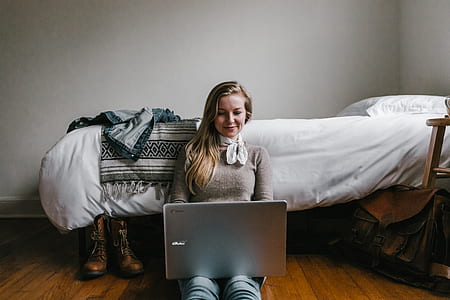 photo of woman using silver laptop computer thumbnail