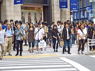 people standing facing pedestrian lane near building thumbnail