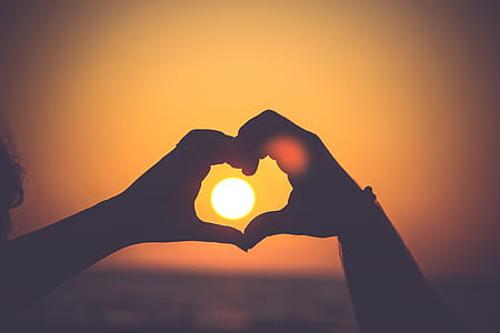 person's hand showing heart figure thumbnail