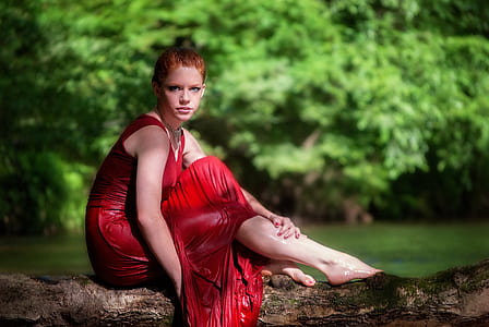 woman wearing red sleeveless dress thumbnail