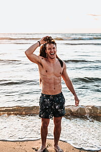 man standing on seashore thumbnail