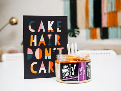 cake hair don't care card near canister with candle thumbnail