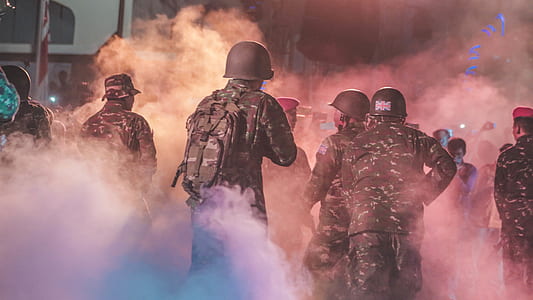 soldiers gathered around smoke thumbnail
