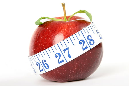 red apple with white measuring tape against white background thumbnail