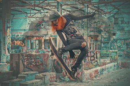woman wearing black sweatshirt plays skateboard thumbnail