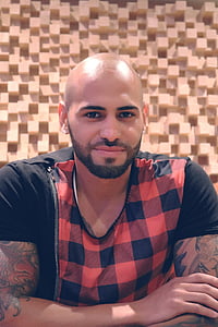 man wearing black and orange checked crew-neck t-shirt thumbnail