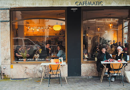 group of people eating at restaurant thumbnail