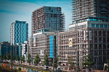 gray concrete buildings beside body of water at daytime thumbnail