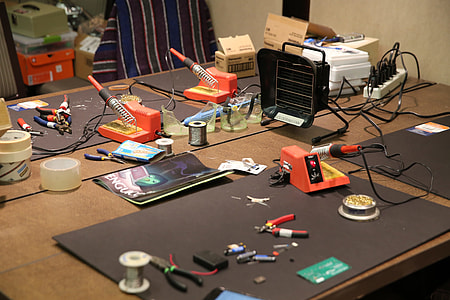assorted tool on brown wooden table thumbnail