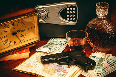photo of pistol on top of map paper thumbnail