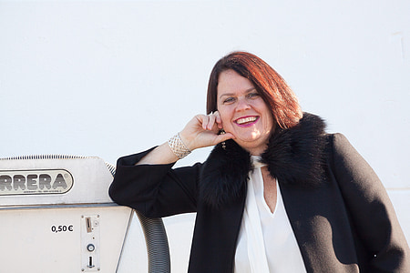 woman holding chick leaning left hand on white machine thumbnail