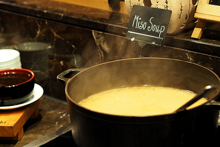 white soup in black stock pot thumbnail