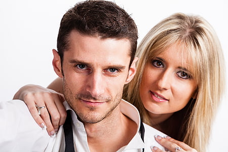 man wears white dress shirt beside woman thumbnail