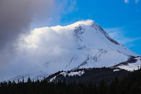 mountain covered with snow under blue sky thumbnail