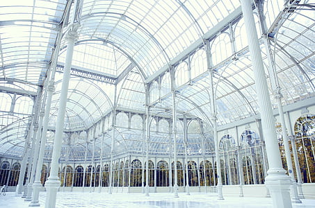 empty white metal framed building with glass roof thumbnail