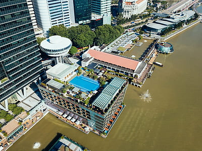bird's-eye view of building near body of water thumbnail